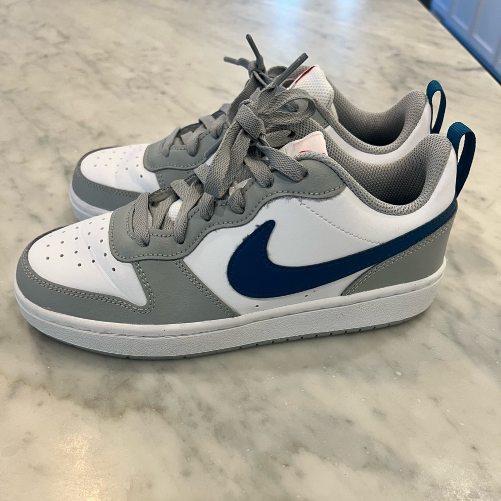 Blue, white and grey tennis shoe. Wore once. Size 5Y